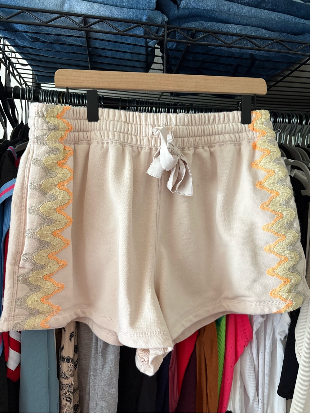 FP Movement by Free People Cream Athletic Shorts with Yellow-Orange Zigzag Trim